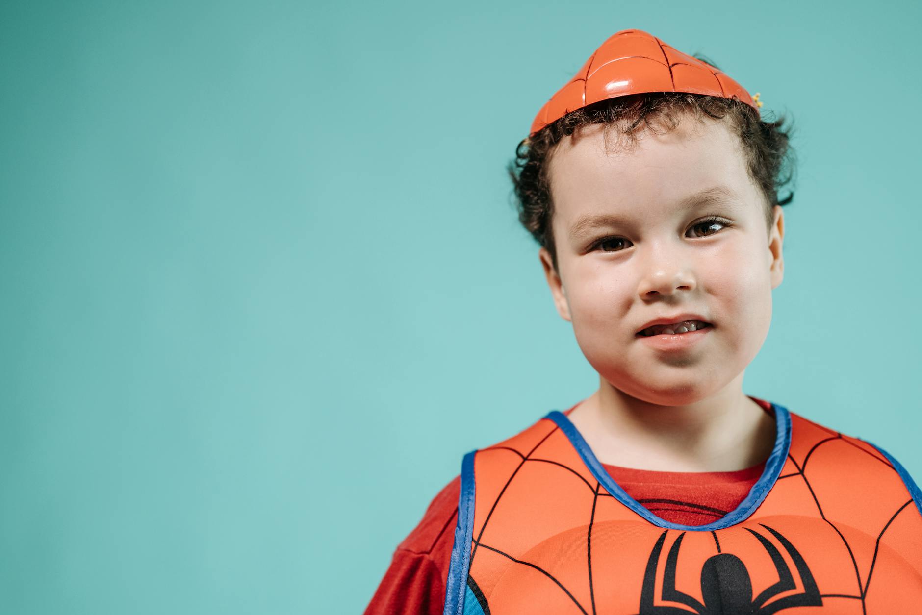 a boy in a spiderman costume