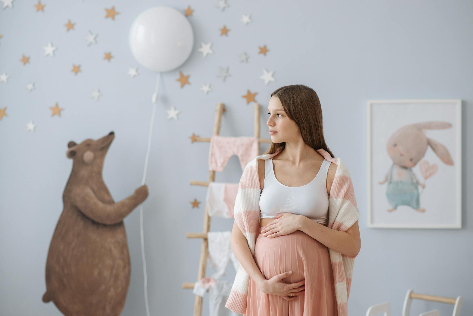 beautiful pregnant woman holding her belly