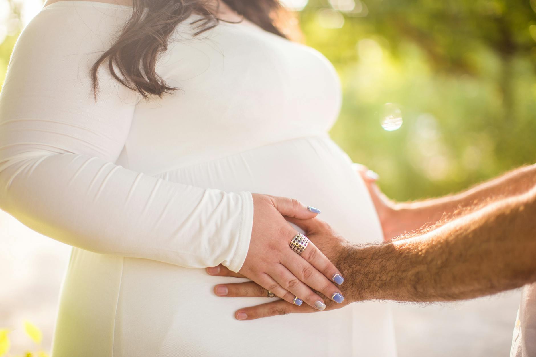 husband holding her wife s belly